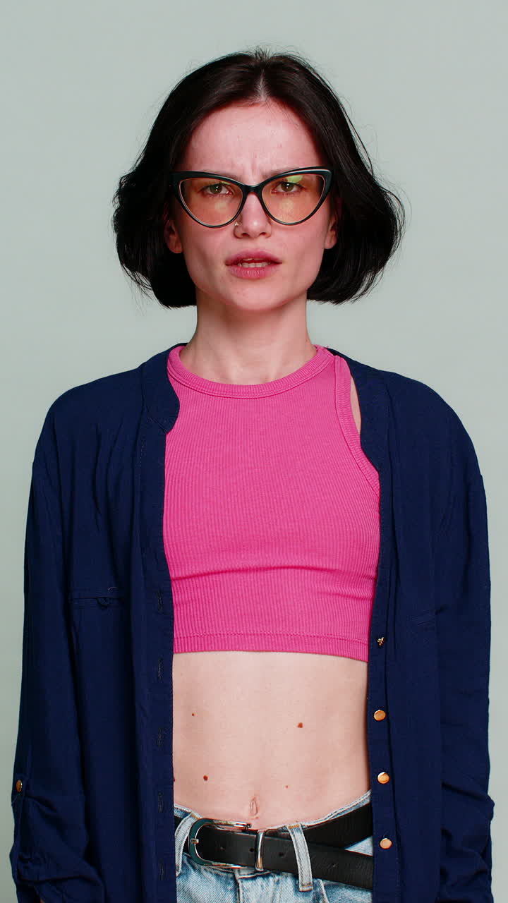 Angry woman screaming desperately spreading arms aggressively emotional breakdown anger frustration