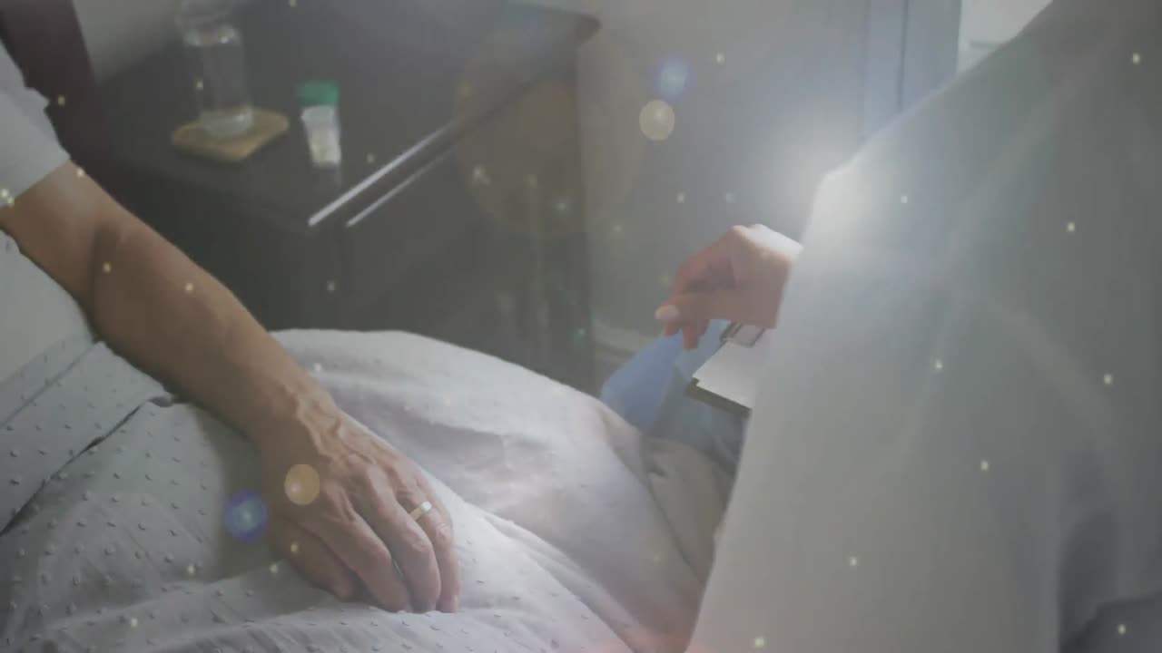 ライトスポットのアニメーション 医師と患者の手を握る