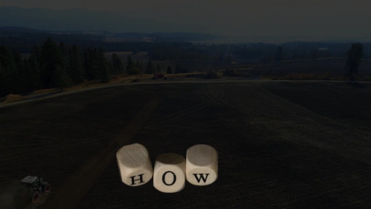 Falling cube starting scene cubes rotating and aligning spelling HOW while vehicle kicking dust