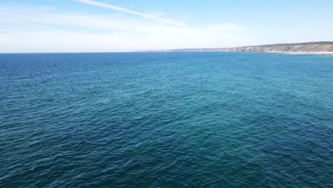 drone flies low on the coast of portugal