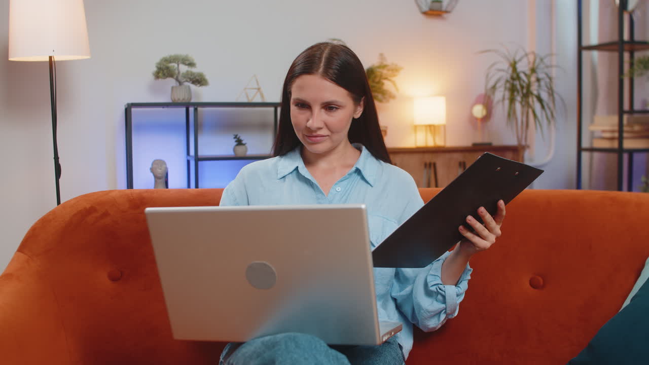 Woman freelancer accountant working with financial documents charts graph reports calculate taxes