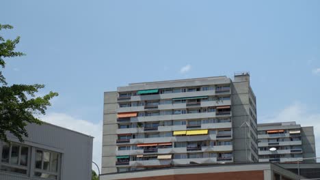 Building-with-multi-colored-awnings-in-Geneva,-Switzerland