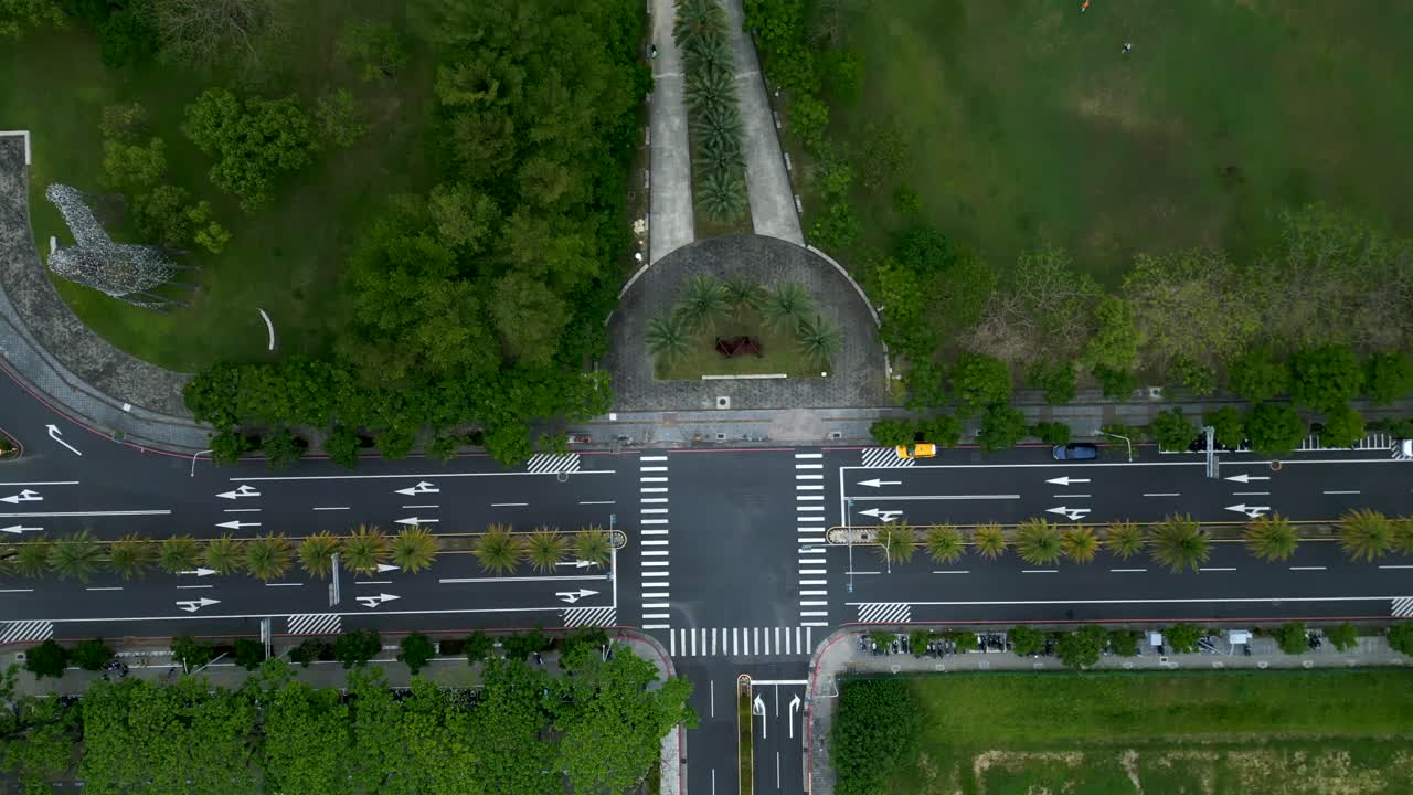 Aerial top-down view of roads and lush greenery around Ka-gi-lang public Park, Chiayi County, Taibao City, Taiwan during daytime.