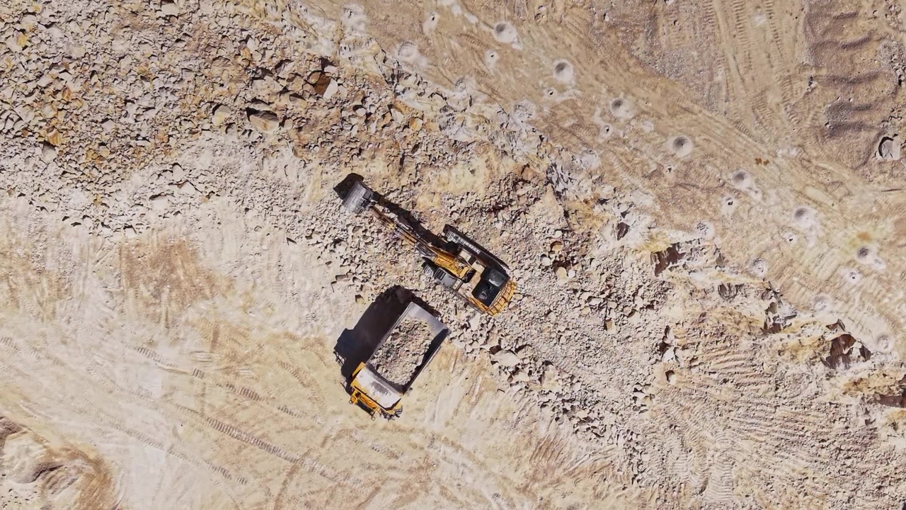 Excavator working on a construction site in an open area