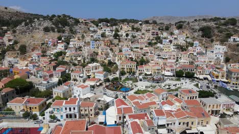 drone shot of the colorfull houses of symi island, greece