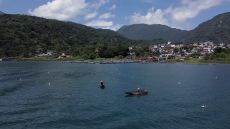 two traditional mayan canoes in a lake