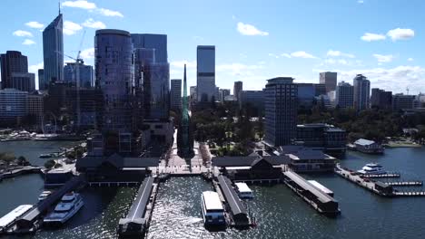 swan bells at barrack street jetty - aerial view - perth cbd skyline - flying in to closeup