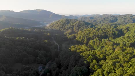 4K-Drone-Video-Flying-High-Above-Trees-in-Smoky-Mountains-near-Appalachian-Trail-along-North-Carolina-and-Tennessee-Border-on-Foggy-Morning