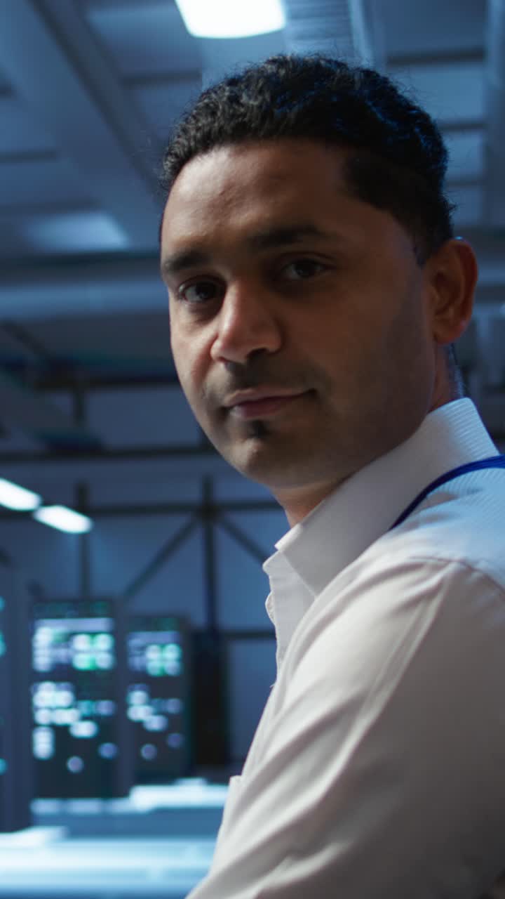 Professional Man Smiling in a Modern Data Center