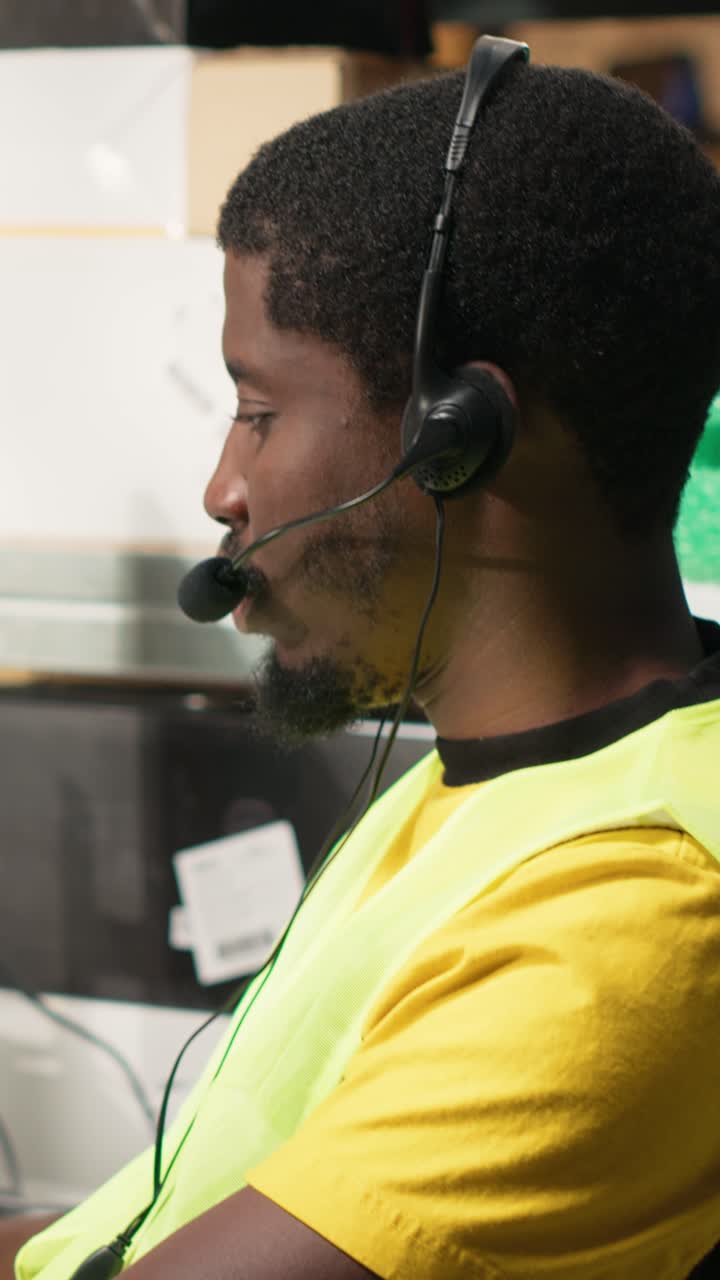 Vertical Video Customer support employee assisting clients in an industrial logistics hub