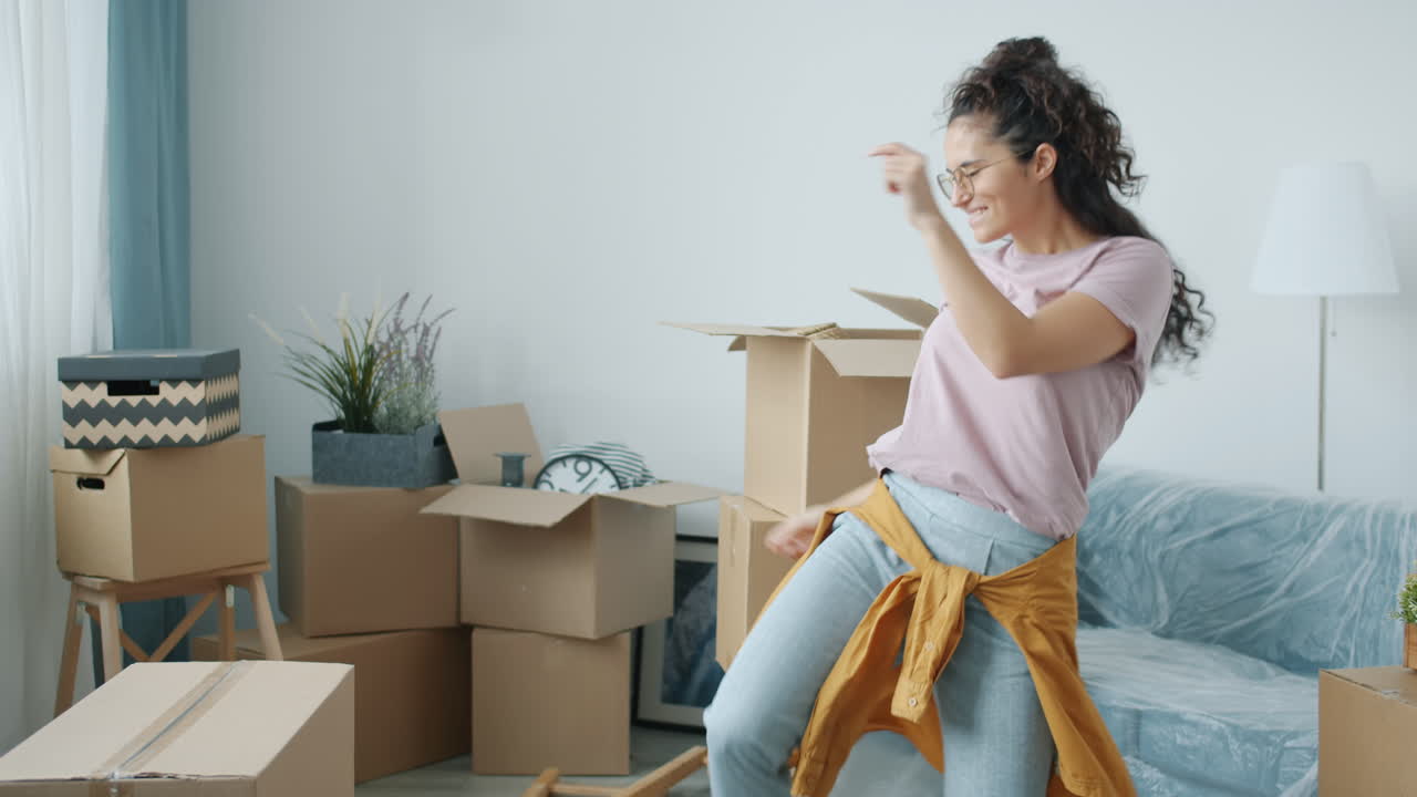 Woman Dancing in a New Apartment