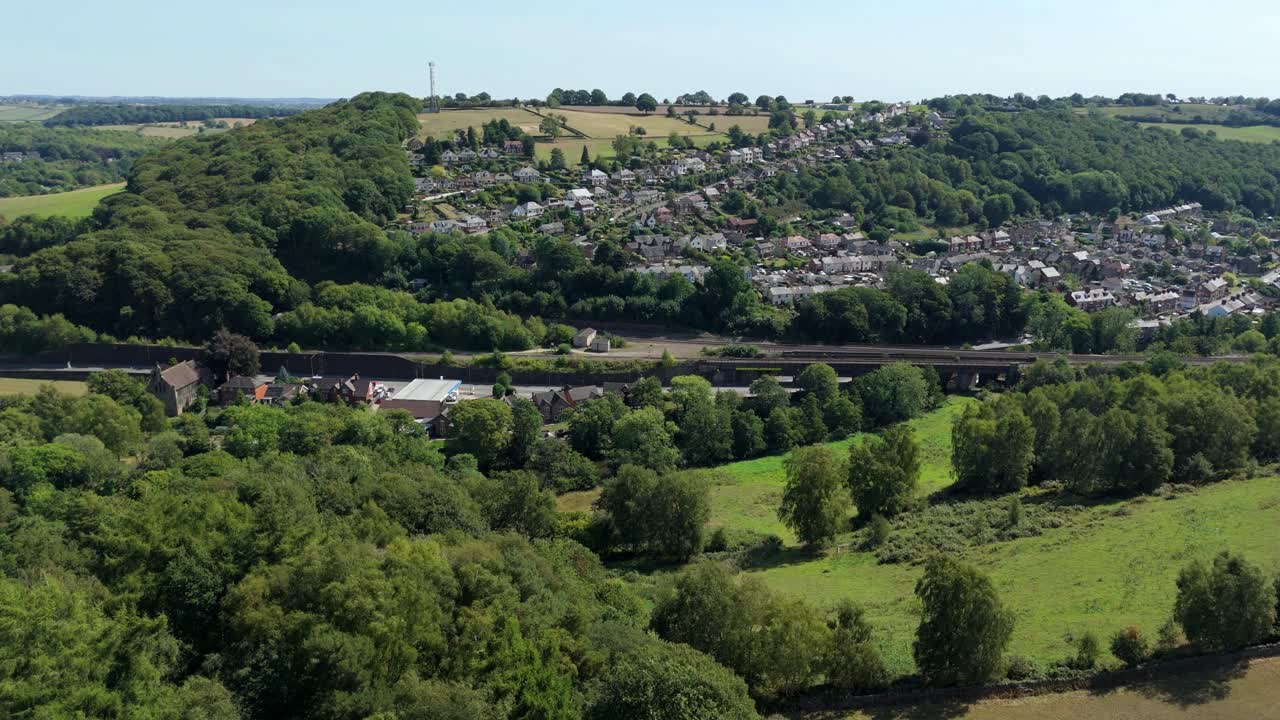 Wide aerial drone view of the Derbyshire Dales near Ambergate England showing scenic green landscape hills valleys and countryside beauty