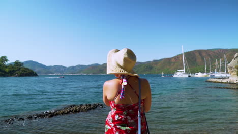 woman enjoying summer vacation at the beach