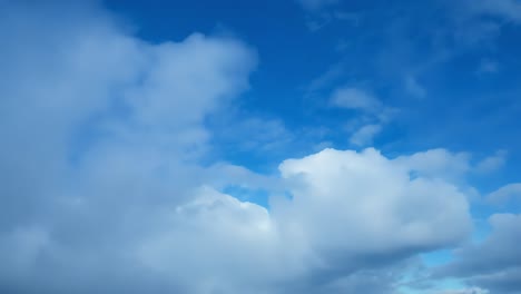 beautiful blue sky with white fluffy clouds