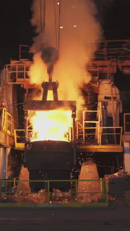 industrial pouring of molten metal in a factory