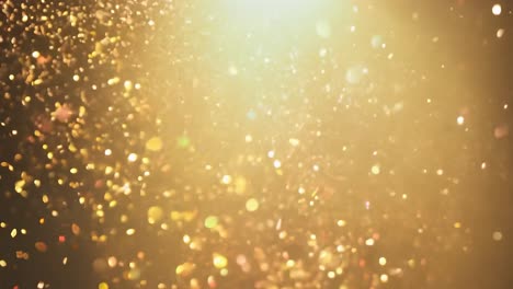 golden confetti bursts with a radiant light beam against a striking black background, creating a festive atmosphere