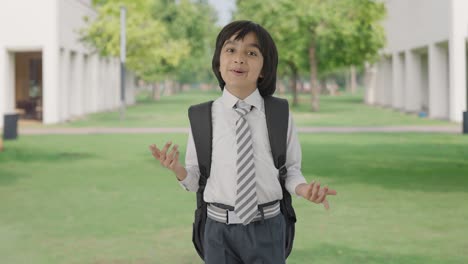 Happy-Indian-school-boy-talking-to-the-camera