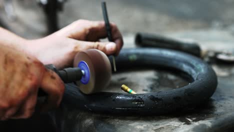 A-Mechanic-prepares-a-tire-tube-for-repair