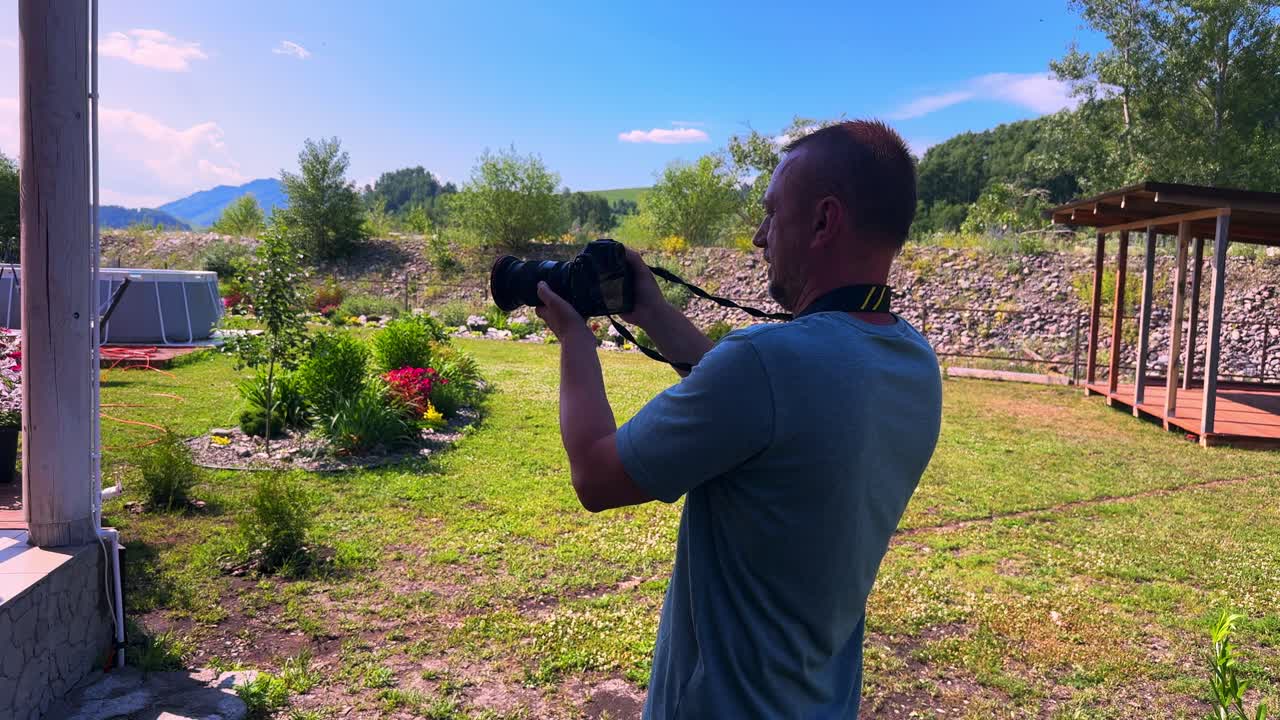 A Passionate Photographer Capturing Nature's Beauty in Bright Sunshine with Lush Greenery and Vibrant Flowers in a Peaceful Outdoor Setting