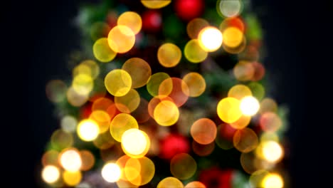 desfocalizadas luces de árbol de año nuevo parpadeando sin problemas en fondo negro. animación en bucle 3d. feliz navidad y feliz año nuevo concepto.