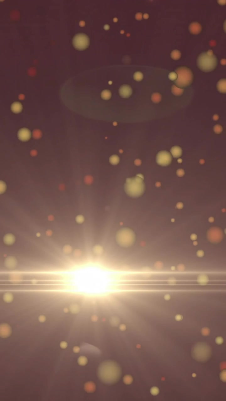 Animazione di particelle luminose che fluttuano su un'esplosione di luce brillante su uno sfondo scuro