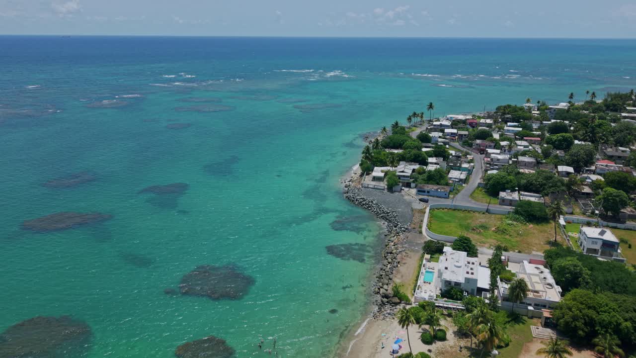 Aerial: Loiza with sand beach and Atlantic Ocean during the day in Puerto Rico, USA, push in drone shot