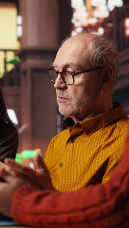 vertical video mature academic colleagues prepare documents for university coursework