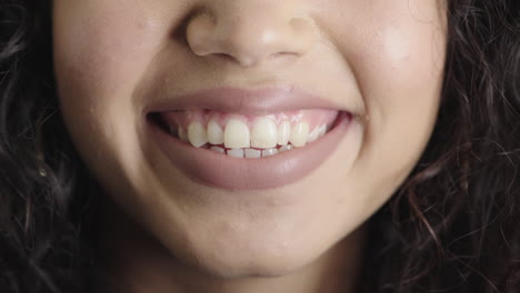 close up woman mouth smiling happy showing healthy white teeth dental health concept