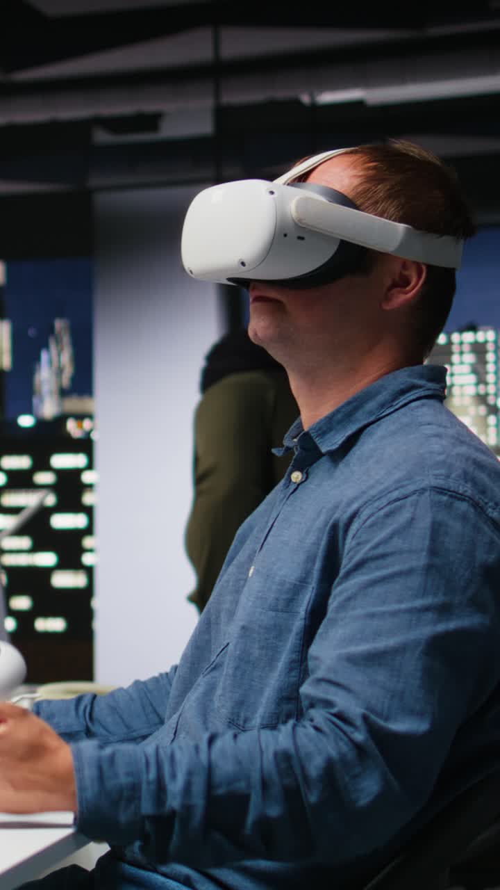 Vertical Video Male game developer using VR glasses and AI tech to design a spaceship