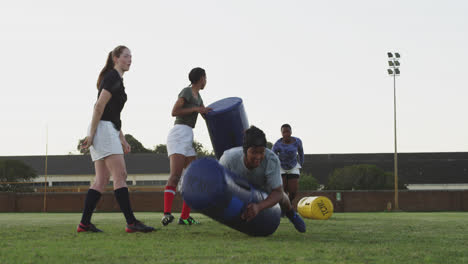 young adult female rugby team training