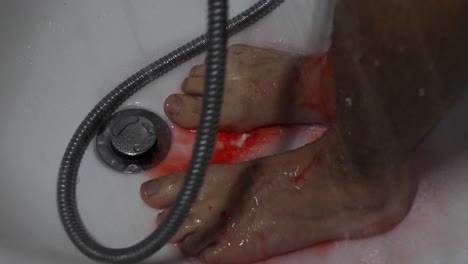 washing away sinful blood in the bathtub in psycho style, closeup