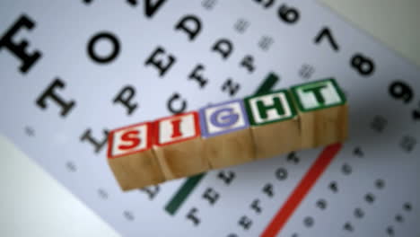 blocks spelling out sight falling on eye test