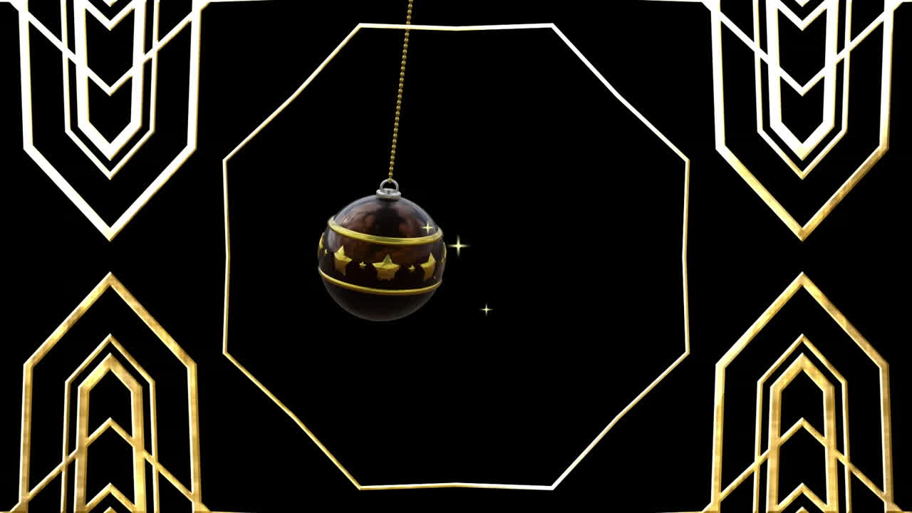 Swinging black and gold christmas bauble over gold kaleidoscopic pattern on black background