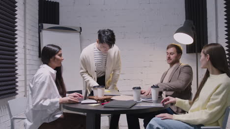 group of diverse colleagues having a team meeting in the boardroom