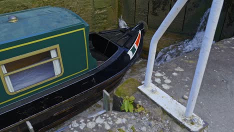 metal wall laddders attched to canal lock system for egress and access safety down to deck of narrowboat