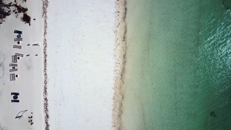 great bird's eye view top view drone shot of white sand beach and sea line paradise film shot on zanzibar at africa tanzania in 2019 cinematic wild nature aerial filmed in 1080, 60p at philipp marnitz