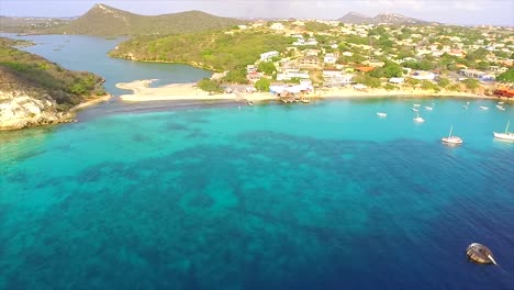 drone looking on a shore line witn hills in the back