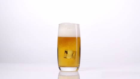 glass of beer with ice