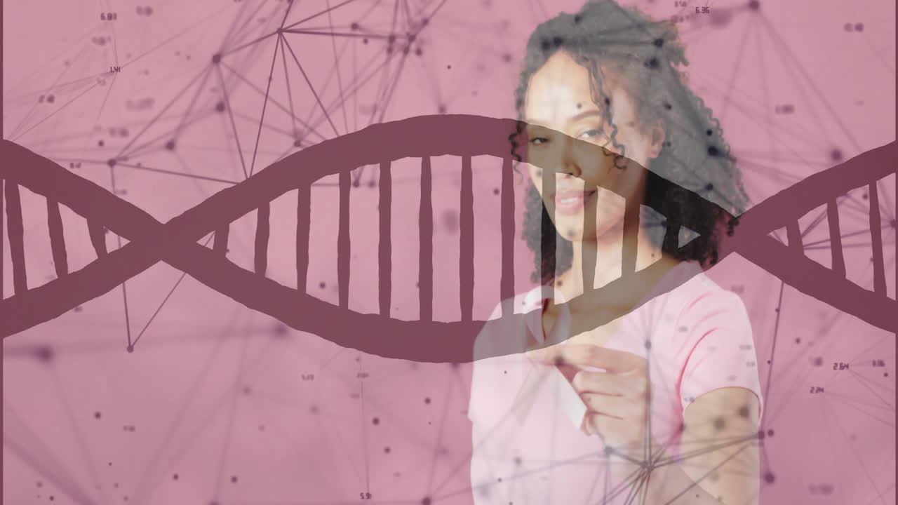 Animation of dna strand and data processing over african american woman holding pink ribbon