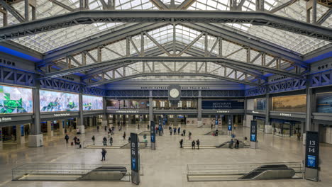 new york ny usa-january 8th, 2021 visitors to the daniel patrick moynihan train hall at pennsylvania station in new york enjoy the new space from the top level