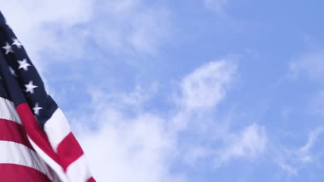 a large american flag waving in the wind