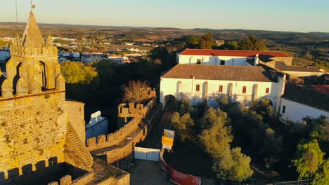 Aerial-shot-of-a-medieval-tower,-reversing-out-with-an-angle