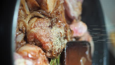 close-up of spiced meat and vegetables cooking in a pan
