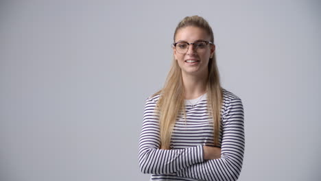 slow motion shot of casually dressed woman wearing glasses