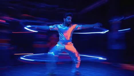 man dancing with neon circles