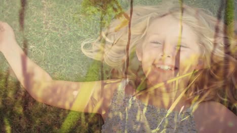 little girl lying on a field of grass