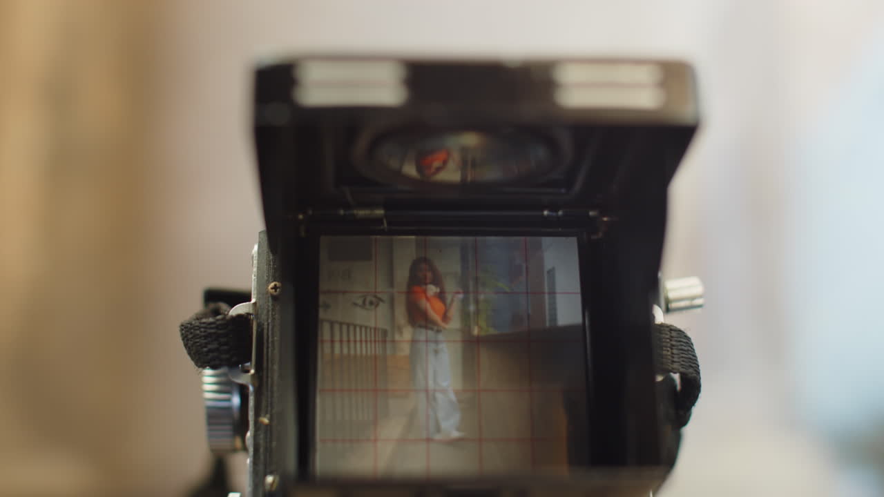 Retro Camera Photographing Woman in Abandoned Place