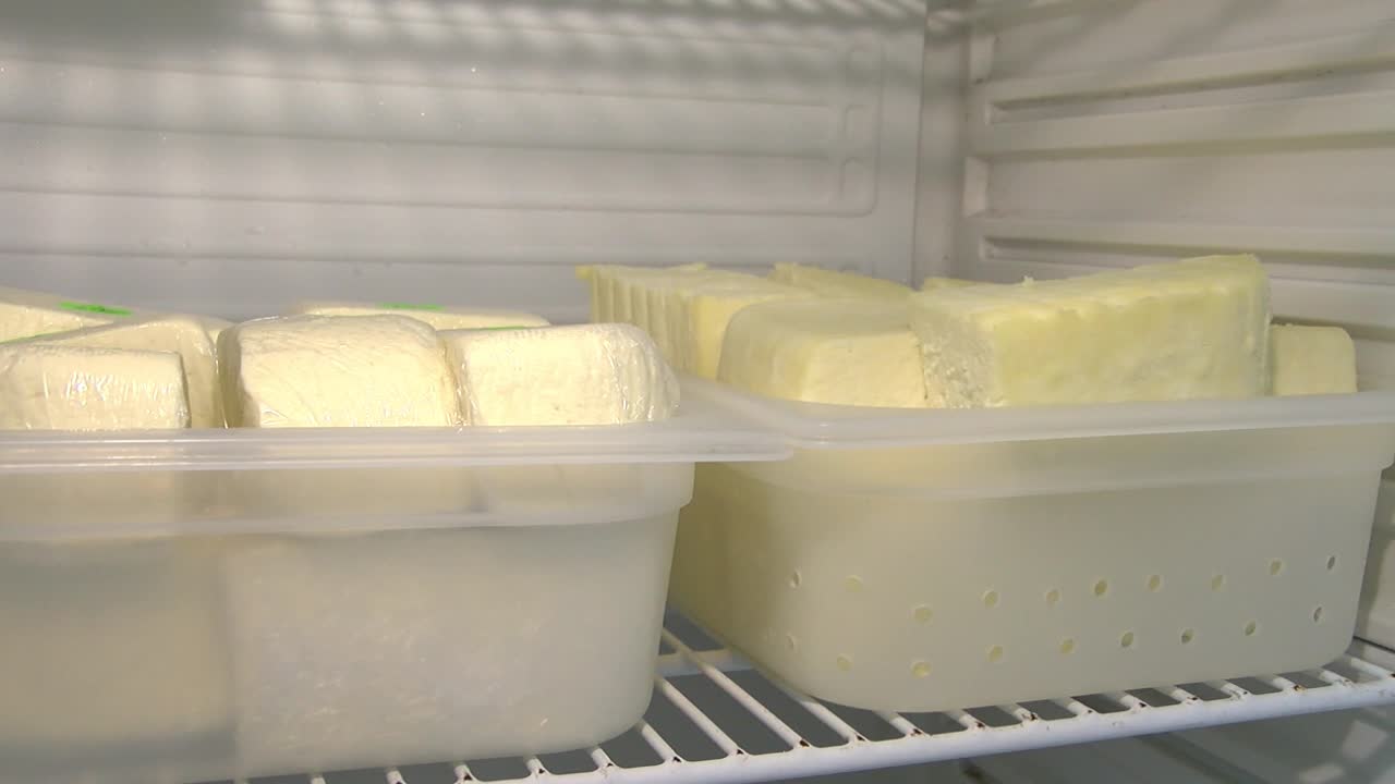 Homemade curds stand in the refrigerator