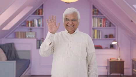 happy indian old man waving hand