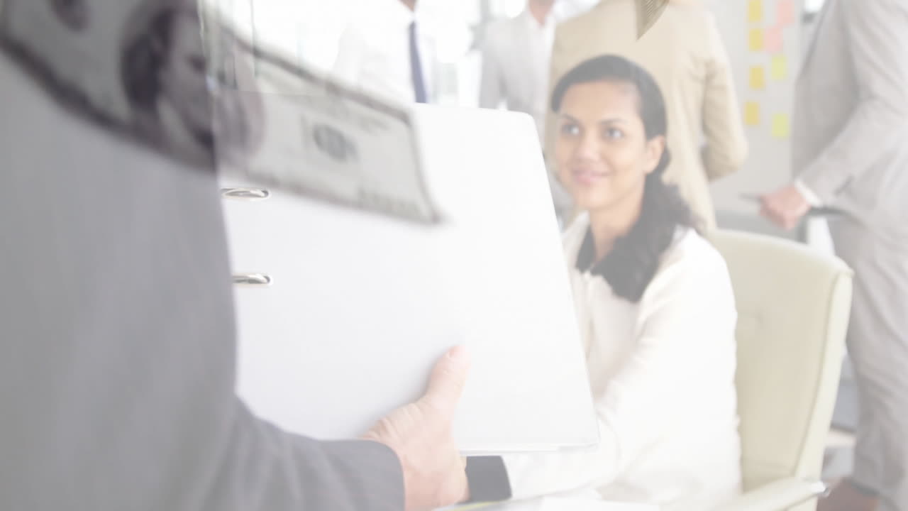 Exchanging documents, diverse professionals in business meeting with financial data animation